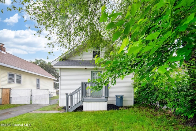 66 Roosevelt Ave, Schenectady, NY 12304 - rear view of house featuring a gate