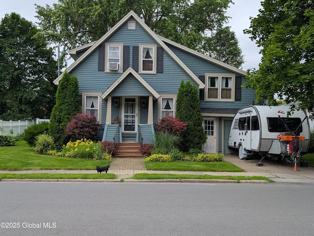 19 High St, Fort Plain, NY 13339 - view of front of property featuring a porch, a front yard, and cooling unit