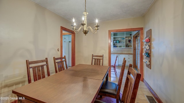 19 High St, Fort Plain, NY 13339 - dining room with a chandelier, ornamental molding, and a textured ceiling