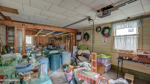 19 High St, Fort Plain, NY 13339 - garage with wood walls and a garage door opener
