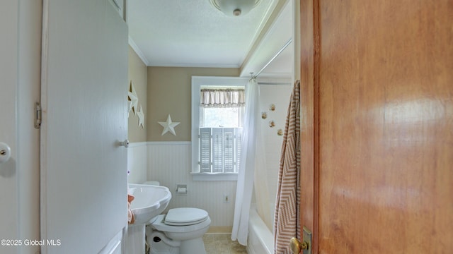 19 High St, Fort Plain, NY 13339 - bathroom featuring crown molding, wainscoting, and shower / tub combo with curtain