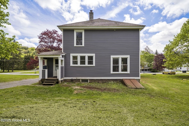 11 River St, Stamford, NY 12167 - rear view of house featuring a chimney, a yard, and roof with shingles
