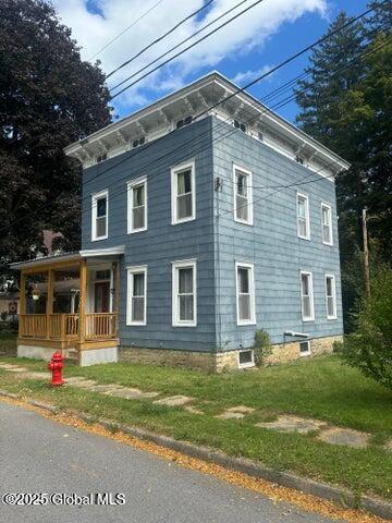 17 W St, Fort Plain, NY 13339 - view of property exterior with a porch and a yard