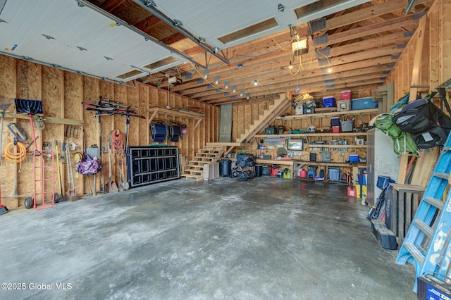 349 Methodist Farm Rd, Sand Lake, NY 12018 - garage with a garage door opener and a workshop area