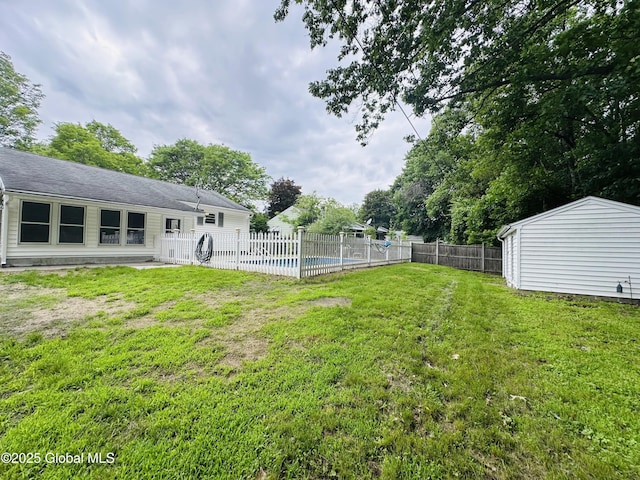 10 Spruce St, Hudson Falls, NY 12839 - fenced backyard featuring a storage unit