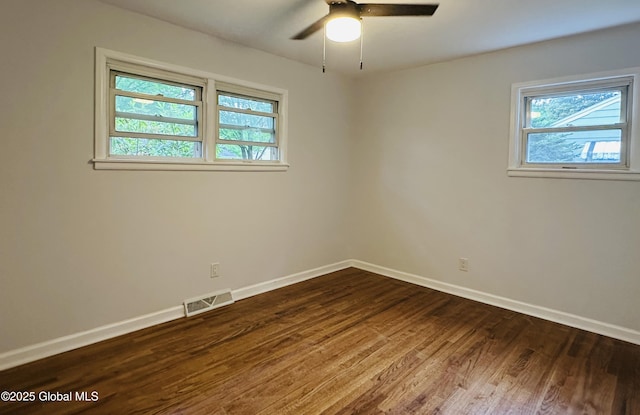10 Spruce St, Hudson Falls, NY 12839 - unfurnished room with plenty of natural light, dark wood finished floors, and ceiling fan