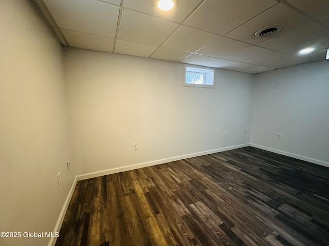10 Spruce St, Hudson Falls, NY 12839 - basement featuring dark wood-style flooring and a drop ceiling