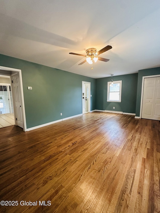 10 Spruce St, Hudson Falls, NY 12839 - unfurnished room featuring a ceiling fan and wood finished floors