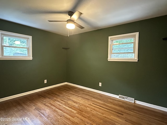 10 Spruce St, Hudson Falls, NY 12839 - unfurnished room with a ceiling fan, healthy amount of natural light, and wood finished floors
