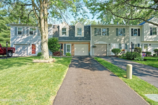 5 Bridgewood Ln, Watervliet, NY 12189 - view of front facade featuring driveway, a front lawn, and an attached garage