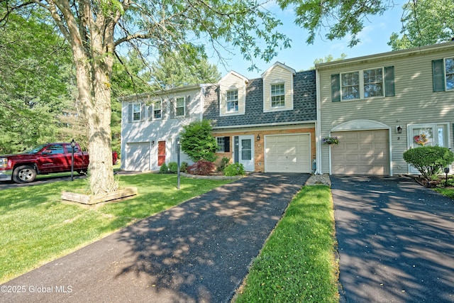 5 Bridgewood Ln, Watervliet, NY 12189 - view of property with driveway, an attached garage, a front lawn, and a shingled roof