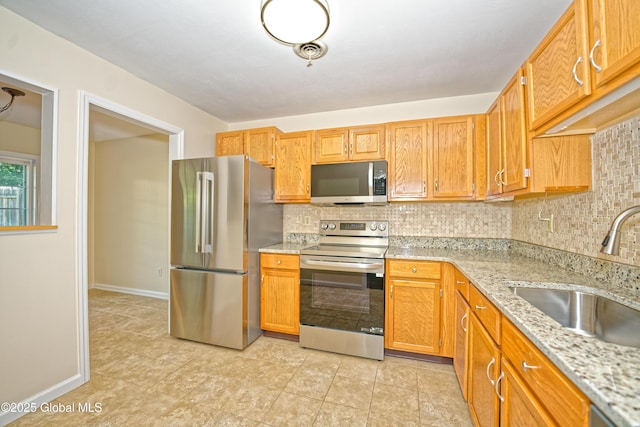 5 Bridgewood Ln, Watervliet, NY 12189 - kitchen with stainless steel appliances, tasteful backsplash, and light stone countertops