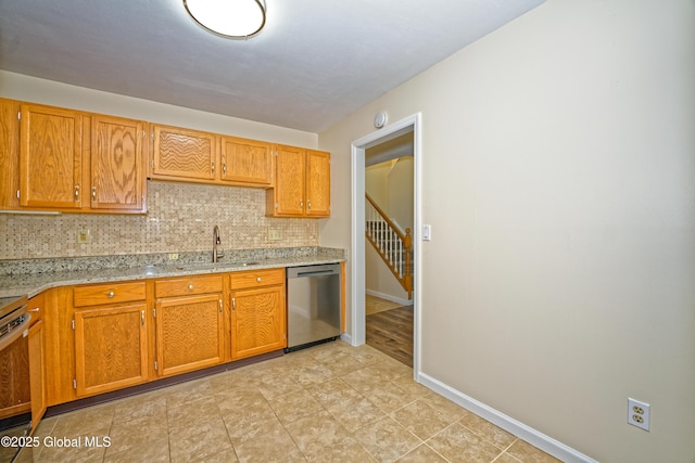 5 Bridgewood Ln, Watervliet, NY 12189 - kitchen with stainless steel dishwasher, decorative backsplash, and brown cabinets