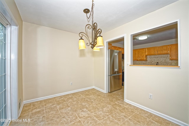 5 Bridgewood Ln, Watervliet, NY 12189 - unfurnished room with a chandelier and baseboards