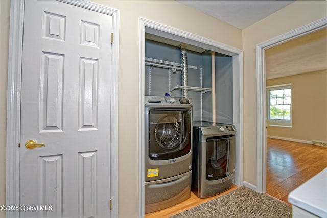 5 Bridgewood Ln, Watervliet, NY 12189 - laundry area with wood finished floors and independent washer and dryer