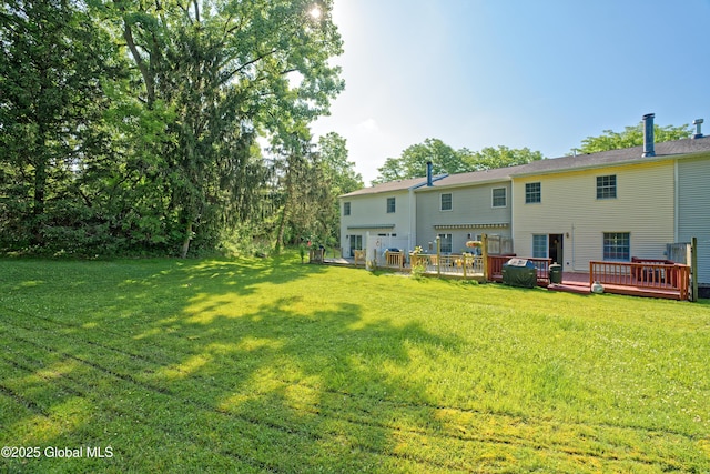 5 Bridgewood Ln, Watervliet, NY 12189 - rear view of property with a wooden deck and a lawn