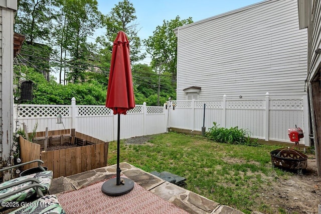 75-77 S 3rd St, Hudson, NY 12534 - fenced backyard featuring a fire pit and a patio area