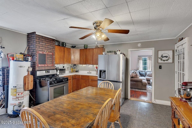 75-77 S 3rd St, Hudson, NY 12534 - kitchen with stainless steel appliances, gas water heater, crown molding, a ceiling fan, and light countertops