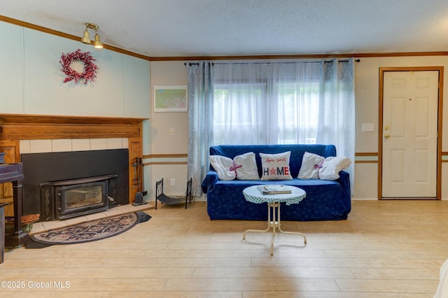 114 Burdick Rd, Johnstown, NY 12078 - living room featuring ornamental molding, wood finished floors, and a textured ceiling