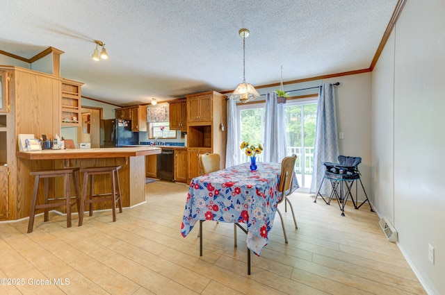 114 Burdick Rd, Johnstown, NY 12078 - dining space with ornamental molding, a textured ceiling, and light wood-style flooring