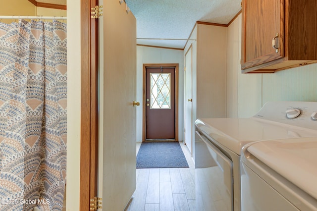 114 Burdick Rd, Johnstown, NY 12078 - washroom with washer and clothes dryer, ornamental molding, cabinet space, and light wood finished floors
