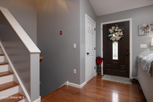 20 Quarry Circle Way, Kingsbury, NY 12839 - entrance foyer with wood finished floors, stairway, and vaulted ceiling