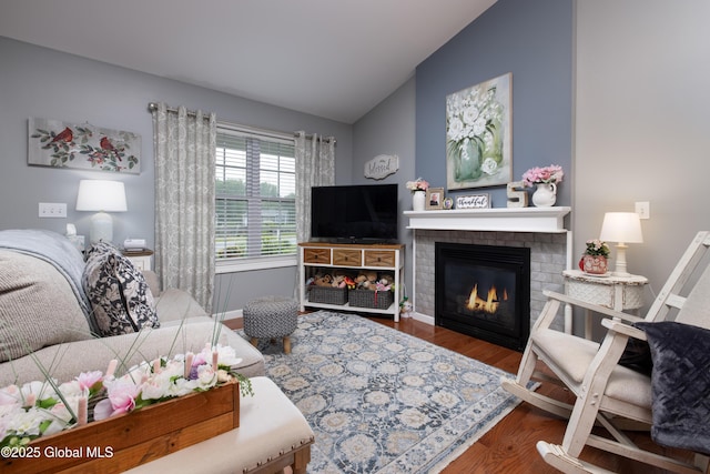 20 Quarry Circle Way, Kingsbury, NY 12839 - living area with vaulted ceiling, wood finished floors, and a fireplace