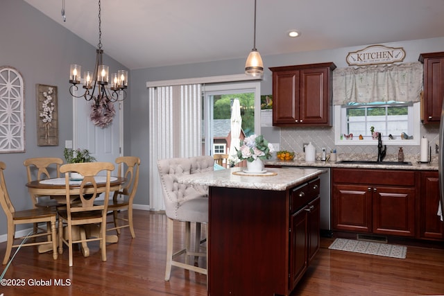 20 Quarry Circle Way, Kingsbury, NY 12839 - kitchen with dark wood-type flooring, tasteful backsplash, a kitchen island, healthy amount of natural light, and lofted ceiling