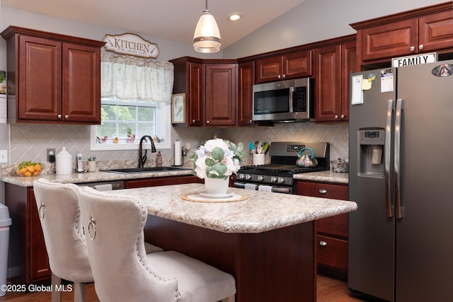 20 Quarry Circle Way, Kingsbury, NY 12839 - kitchen featuring stainless steel appliances, backsplash, a kitchen island, pendant lighting, and lofted ceiling