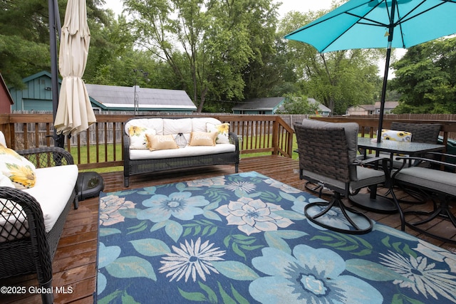 20 Quarry Circle Way, Kingsbury, NY 12839 - deck featuring a fenced backyard, an outdoor living space, outdoor dining space, and view of wooded area