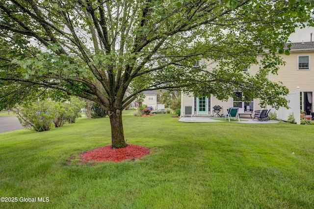 125 Bridgewood Ln, Colonie, NY 12189 - view of grassy yard featuring a patio area