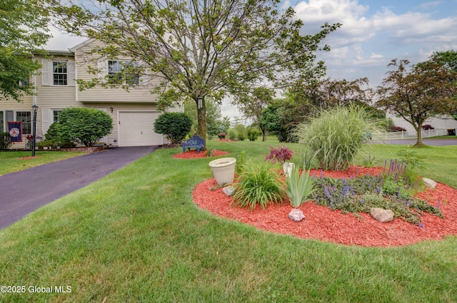 125 Bridgewood Ln, Colonie, NY 12189 - view of green lawn with a garage and asphalt driveway