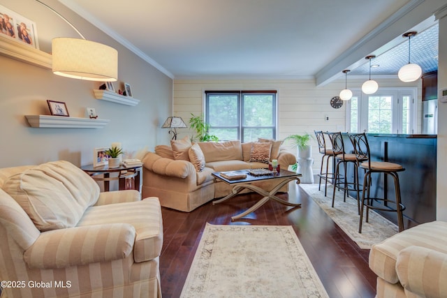 125 Bridgewood Ln, Colonie, NY 12189 - living room with healthy amount of natural light, dark wood finished floors, ornamental molding, beam ceiling, and wooden walls