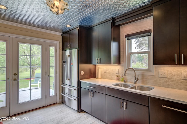 125 Bridgewood Ln, Colonie, NY 12189 - kitchen featuring stainless steel fridge, healthy amount of natural light, light countertops, an ornate ceiling, and ornamental molding