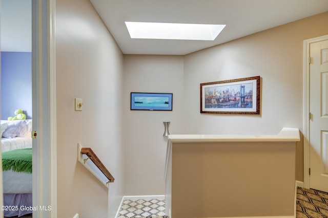 125 Bridgewood Ln, Colonie, NY 12189 - staircase featuring a skylight and baseboards