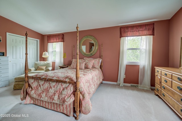 125 Bridgewood Ln, Colonie, NY 12189 - bedroom with light carpet and multiple windows