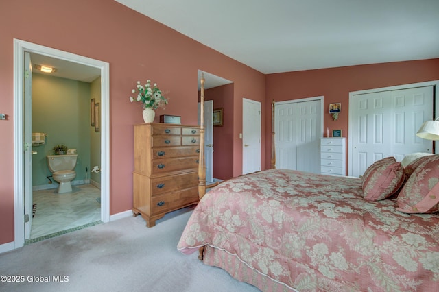 125 Bridgewood Ln, Colonie, NY 12189 - bedroom featuring multiple closets, carpet floors, and connected bathroom