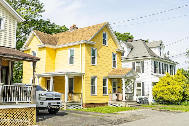 53 Broad St, Catskill, NY 12414 - view of front of property featuring covered porch, a chimney, and roof with shingles