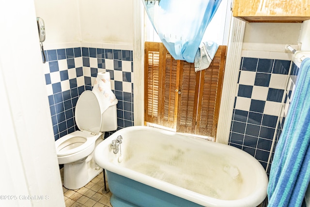 53 Broad St, Catskill, NY 12414 - full bath with tile walls, a soaking tub, tile patterned floors, and a wainscoted wall