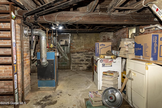 53 Broad St, Catskill, NY 12414 - unfinished below grade area with brick wall and a heating unit