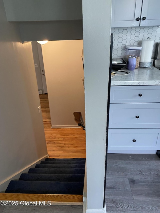 9 Brayton St, Colonie, NY 12205 - staircase featuring wood finished floors and baseboards