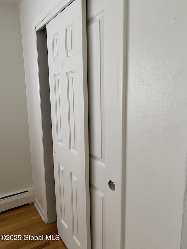 9 Brayton St, Colonie, NY 12205 - detailed view of a baseboard radiator and wood finished floors