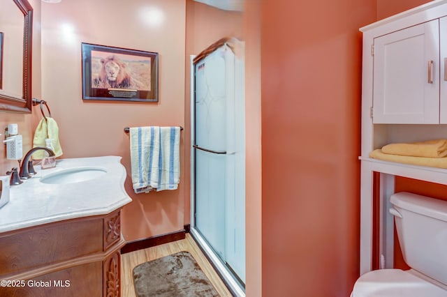 448 State Highway 334, Johnstown, NY 12095 - bathroom with vanity, a stall shower, and wood finished floors