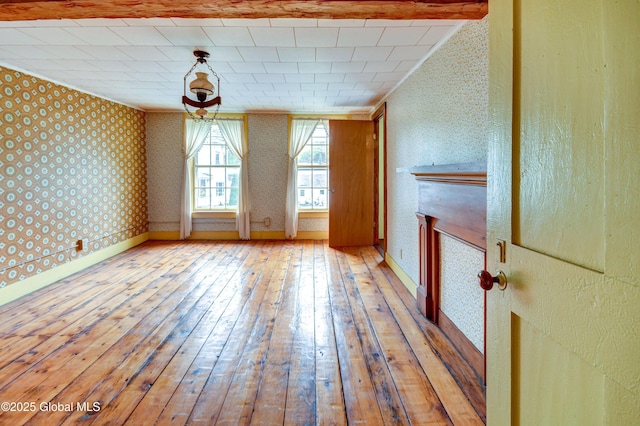 448 State Highway 334, Johnstown, NY 12095 - unfurnished room featuring wallpapered walls, hardwood / wood-style floors, and crown molding