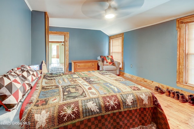448 State Highway 334, Johnstown, NY 12095 - bedroom featuring wood finished floors, vaulted ceiling, ornamental molding, and ceiling fan