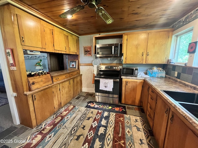 448 State Highway 334, Johnstown, NY 12095 - kitchen with appliances with stainless steel finishes, wood ceiling, ceiling fan, light countertops, and brown cabinets