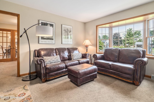77 Rotterdam Dr, Bethlehem, NY 12077 - carpeted living area featuring baseboards
