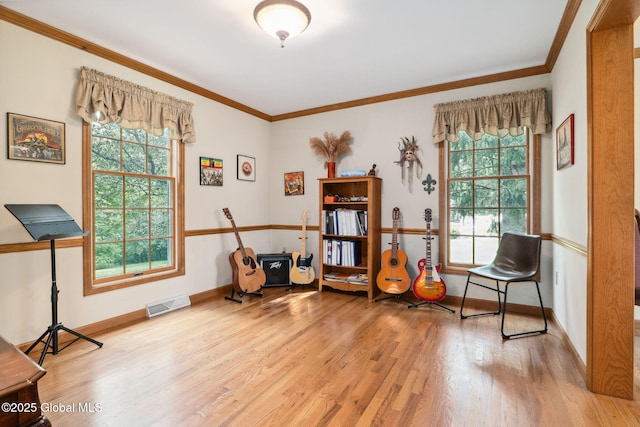 77 Rotterdam Dr, Bethlehem, NY 12077 - sitting room with ornamental molding and wood finished floors