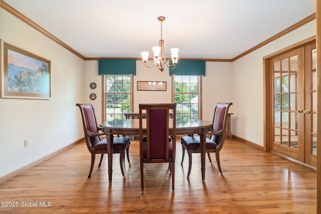 77 Rotterdam Dr, Bethlehem, NY 12077 - dining room with a chandelier, light wood finished floors, and ornamental molding