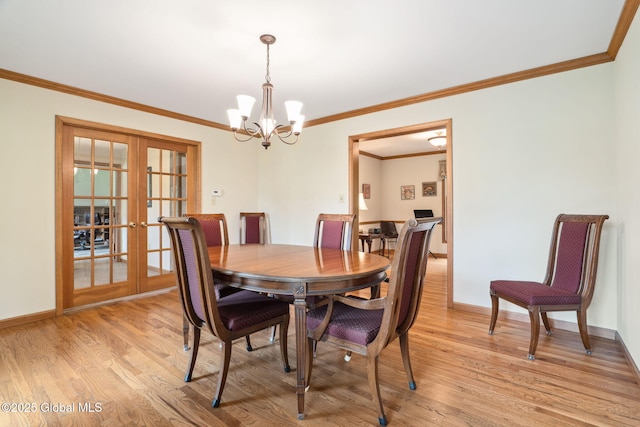 77 Rotterdam Dr, Bethlehem, NY 12077 - dining space with french doors, a chandelier, light wood-style flooring, and crown molding